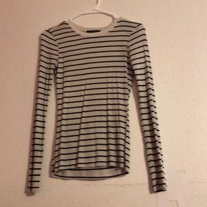 Tight fitting cotton ribbed long sleeve.